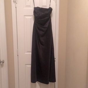 Black floor length gown. Black and silver beaded top
